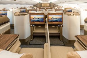 Business Class is configured in a 1-2-1 layout ensuring every passenger has direct aisle access and a spacious, private environment for both work and relaxation. The fully lie-flat seat is wrapped in soft cream leather and features a personal minibar and wireless charging for comfort and convenience. At the back of the cabin is a snack display area allowing passengers to help themselves to refreshments throughout the flight.