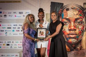 NVV39 - Director: Neema Ngelime and Producer: Ivy Kiru of the Kenyan film THE ONES WITH THE TEMPERED FLOWERS, with Director of the Durban FilmMart Magdalene Reddy receive one of their many awards.